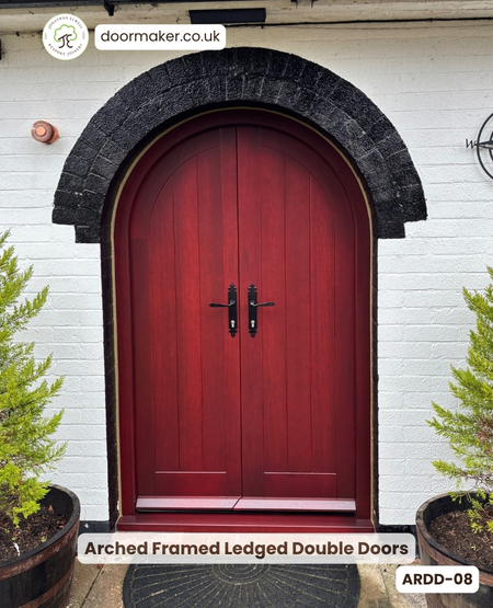 arched double doors stained to a mahogany finish