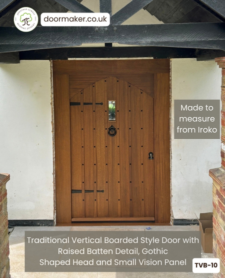 Traditional Vertical Boarded Style Door with Raised Batten Detail, Gothic Shaped Head with
Small Vision Panel and Frame Ref. TVB-10