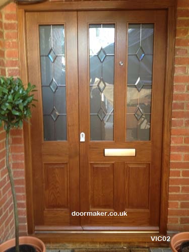 oak door glazed with timber panels