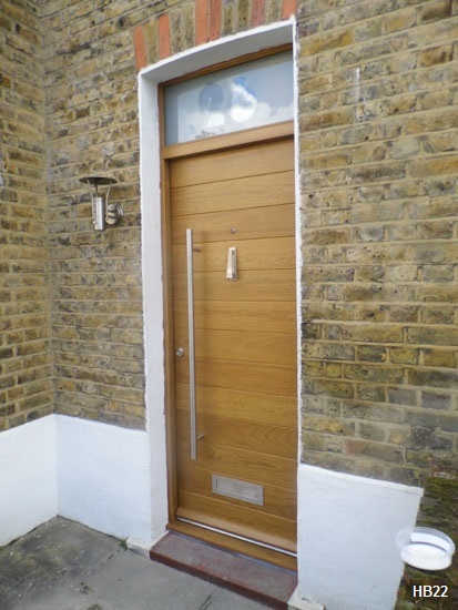 contemporar door with glazed toplight