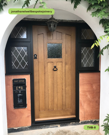 traditional front door angled panelled and side windows